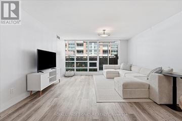 Toronto (Waterfront Communities) condo for rent - A living room with a television and a couch.