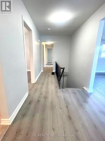 Toronto (Agincourt South-Malvern West) apartment for rent - A hallway with wood flooring and white walls.