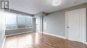 Toronto (Bendale) condo for rent - A room with a white door and a window with a view of the city.