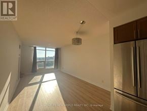 Richmond Hill (Harding) condo for rent - A sunny room with wooden floors and a large window.