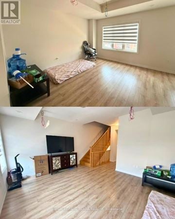 Oshawa (Windfields) townhouse for rent - A living room with a couch and a television.