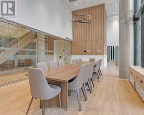 Toronto (Downsview-Roding-Cfb) condo for rent - A conference room with a long table and chairs.