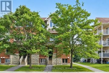 Ottawa townhouse for rent - A building with a tree in front of it.