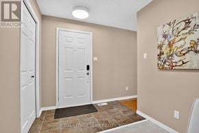 Ottawa townhouse for rent - A white door is in a room with beige walls.