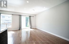 Milton (Dp Dorset Park) townhouse for rent - A room with wooden flooring and a large window with curtains.