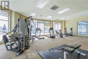 Toronto (Bendale) condo for rent - A well-equipped home gym with various exercise machines.