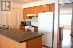 Toronto (Bendale) condo for rent - A kitchen with a refrigerator, microwave, and oven.