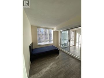 Coquitlam apartment for rent - A bedroom with a bed and a window.