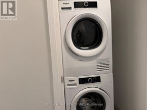 Markham (Unionville) condo for rent - A white washing machine with the door open.
