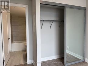 Markham (Unionville) condo for rent - A glass door closet with a white door and a white wall.