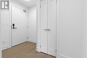 Toronto (Yonge-Eglinton) condo for rent - A white door with a black handle and a small window above it.