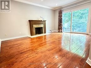 Markham (Unionville) apartment for rent - A living room with a fireplace and wood flooring.