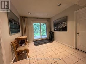 Toronto (Hillcrest Village) apartment for rent - A room with a sliding glass door leading to a backyard.