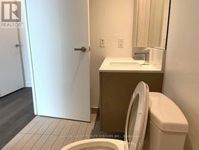 Mississauga (Creditview) condo for rent - A bathroom with a toilet, sink, and mirror.