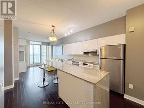Toronto (Bayview Village) condo for rent - A kitchen with a refrigerator, stove, and countertop.