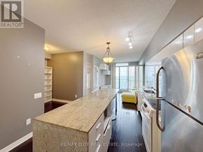 Toronto (Bayview Village) condo for rent - A kitchen with a granite countertop and stainless steel appliances.