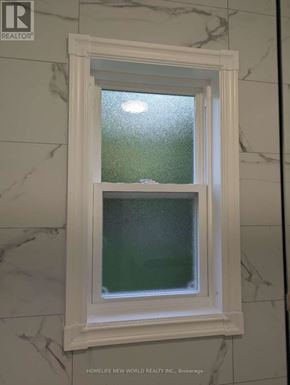 Toronto (Willowdale East) apartment for rent - A window in a bathroom with a frosted glass pane.