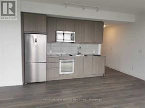 Toronto (Henry Farm) condo for rent - A kitchen with a refrigerator, microwave, and oven.