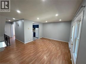 Woodstock townhouse for rent - A room with wooden flooring and white walls.