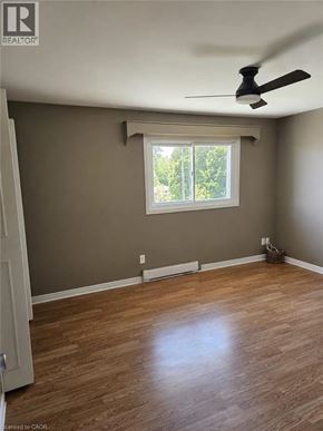 Woodstock townhouse for rent - A room with a ceiling fan and a window.