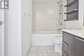 Toronto (Mimico) condo for rent - A bathroom with a toilet, a tub, and a shower.