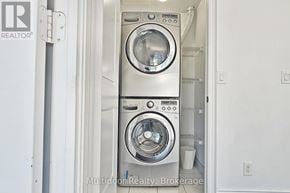 Toronto (Mimico) condo for rent - A washer and dryer in a small laundry room.