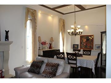 Langley apartment for rent - A living room with a grey couch and a chandelier.