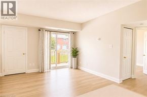 Burlington townhouse for rent - A room with a sliding glass door leading to a balcony.