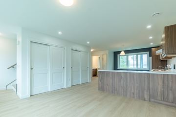 Dartmouth apartment for rent - A spacious kitchen with a bar counter and a staircase.