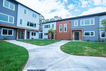 Dartmouth apartment for rent - A row of houses with a driveway in the middle.