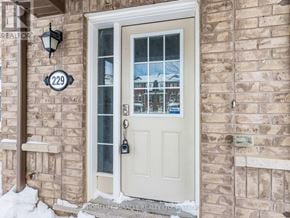Brampton (Northwest Brampton) townhouse for rent - A white door with a glass window is on a brick wall.