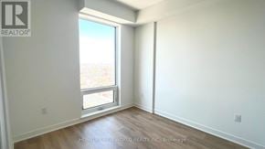 Toronto (Dovercourt-Wallace Emerson-Junction) condo for rent - A room with a window and wooden flooring.