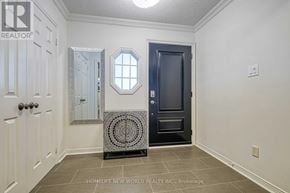 Markham (Unionville) apartment for rent - A hallway with a black door and a tiled floor.