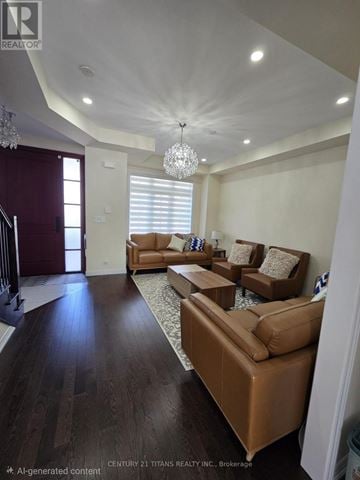 Bradford West Gwillimbury (Bradford) apartment for rent - A living room with brown leather furniture and a chandelier.