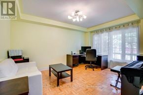 Newmarket (Summerhill Estates) apartment for rent - A living room with a couch, a desk, and a chair.
