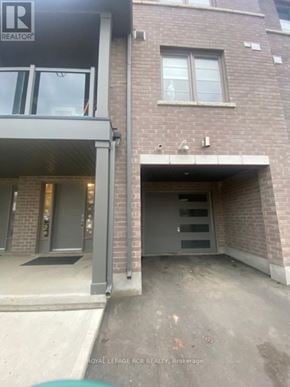 Kitchener townhouse for rent - A building with a sign that says REALTOR on it.