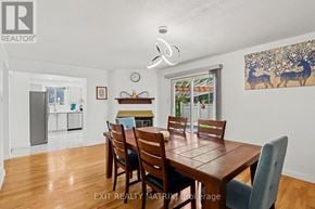 Ottawa apartment for rent - A dining room with a wooden table and chairs.