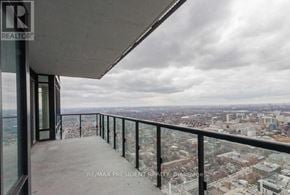 Toronto (Kensington-Chinatown) condo for rent - A balcony with a view of a cityscape.