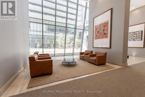 Toronto (Church-Yonge Corridor) condo for rent - A waiting area with chairs and a table with a carpet and a painting on the wall.