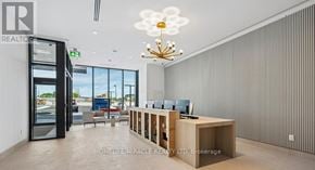 Toronto (Clairlea-Birchmount) condo for rent - A real estate office with a large window and a chandelier.