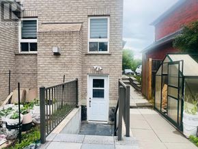 Whitby (Rolling Acres) apartment for rent - A white door is on the front of a brick building.