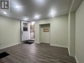 Whitby (Rolling Acres) apartment for rent - A room with a door and a window with a view of a construction site.