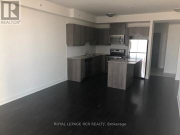 Vaughan (Concord) condo for rent - A kitchen with a black counter top and a white wall.