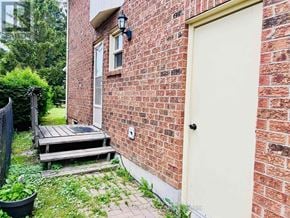 Newmarket (Glenway Estates) apartment for rent - A red brick house with a white door and a small porch.