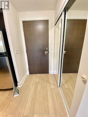 Markham (Unionville) condo for rent - A hallway with a wooden floor and a white wall.