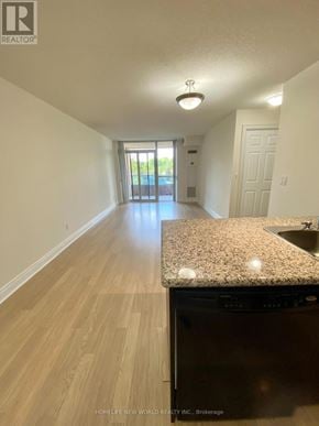 Markham (Unionville) condo for rent - A long hallway with a kitchen area at the end.