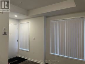 Vaughan (Vaughan Corporate Centre) townhouse for rent - A room with a window covered in blinds and a door.