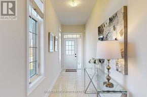 Cavan Monaghan (Cavan Twp) townhouse for rent - A hallway with a glass table and a lamp on it.