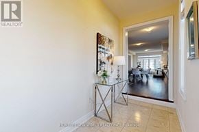 Cavan Monaghan (Cavan Twp) townhouse for rent - A room with a glass table and a painting on the wall.