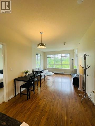 Vancouver apartment for rent - A well-lit living room with a dining table and chairs.